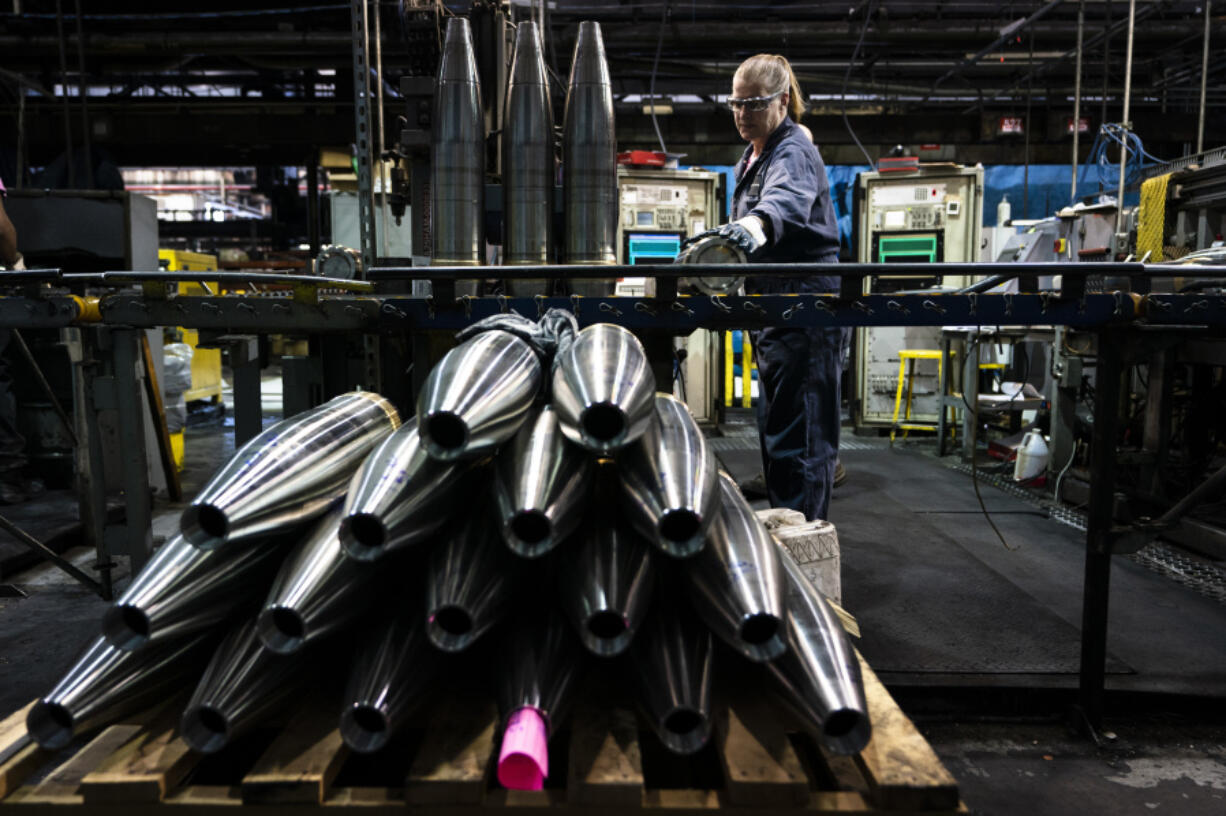 FILE -A steel worker moves a 155 mm M795 artillery projectile during the manufacturing process at the Scranton Army Ammunition Plant in Scranton, Pa., Thursday, April 13, 2023. The Pentagon could get weapons moving to Ukraine within days if Congress passes a long-delayed aid bill. That&rsquo;s because it has a network of storage sites in the U.S. and Europe that already hold the ammunition and air defense components that Kyiv desperately needs. Moving fast is critical, CIA Director Bill Burns said Thursday, April 18, 2024.