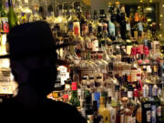 Bottles of alcohol sit on shelves at a bar in Houston. Moderate drinking was once thought to have benefits for the heart, but better research methods starting in the 2010s have thrown cold water on that.