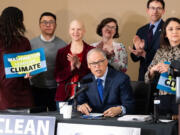 Washington Gov. Jay Inslee signs labor rights and environmental protection bills into law. Thursday, March 25.