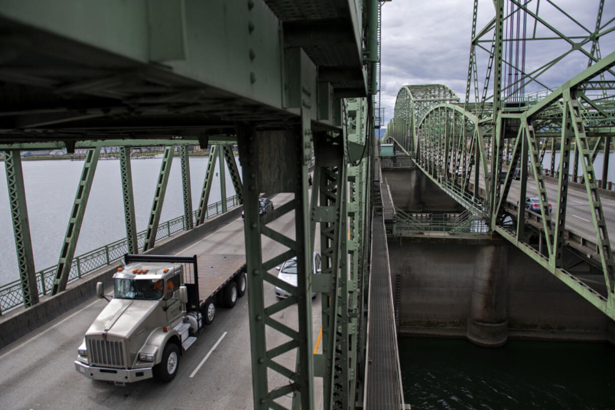 A truck driver travels northbound on the Interstate Bridge on Aug. 31, 2021.