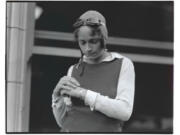 Dorothy Hester examines a silver bracelet she received in November 1930 for her stunt flying accomplishments. She held the world&rsquo;s record for 69 outside loops &mdash; 62 deemed perfect circles &mdash; for 58 years until it was broken in 1989.