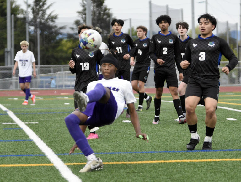 Heritage's Hakim Keita attempts a bicycle kick as a host of Mountain View players look on during a 3A GSHL boys soccer game on Wednesday, May 1, 2024, at Mountain View High School.
