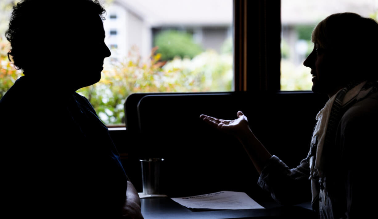 A discussion takes place at Freeland Library during a gathering of people with differing views on Israel and Palestine, Sunday, April 7, 2024, on Whidbey Island, Washington. The meeting is moderated by Braver Angels, a group that tries to bridge American political polarization.