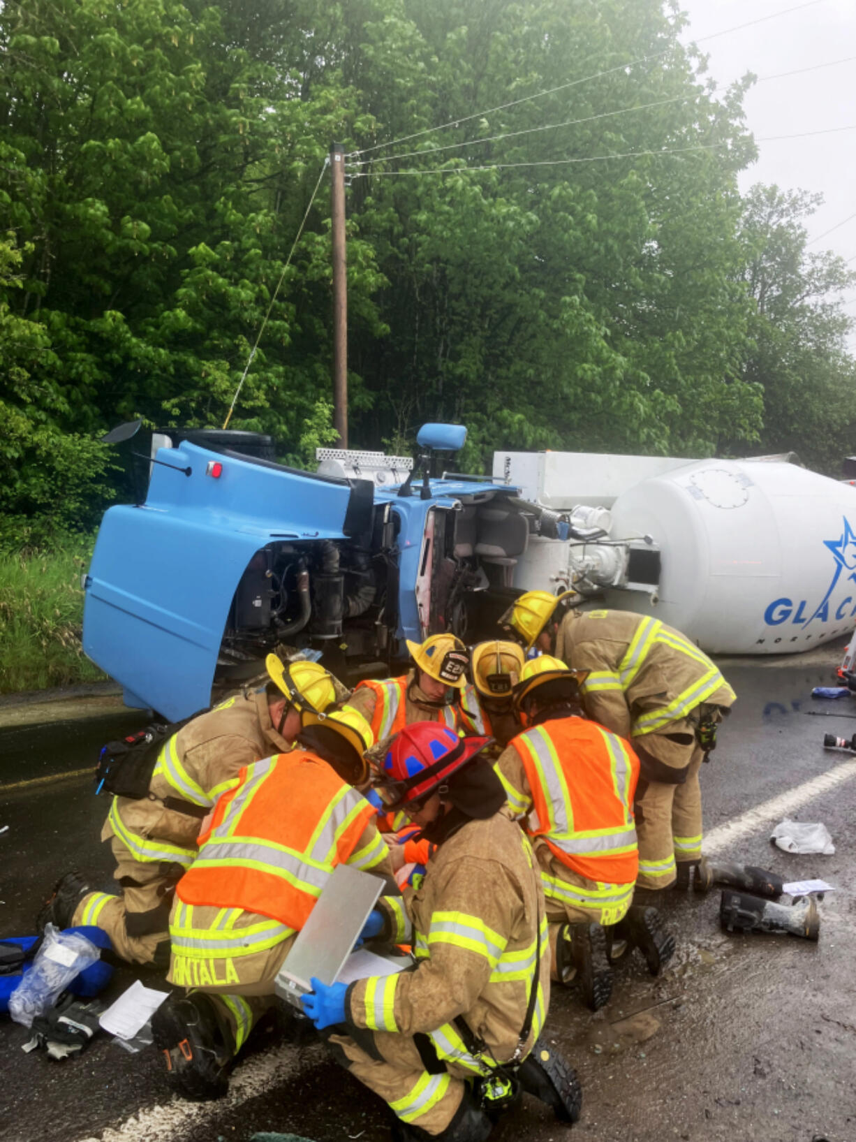 Crews from Clark-Cowlitz Fire Rescue extracted a driver from an overturned concrete mixer truck Saturday. The truck was leaking diesel fuel and concrete onto the street.