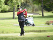 Camas' Jacinda Lee watches her tee shot on the 15th hole during the Class 4A District 4 girls golf tournament on Tuesday at Lewis River Golf Course. Lee won for the third year in a row, this time by 16 strokes.
