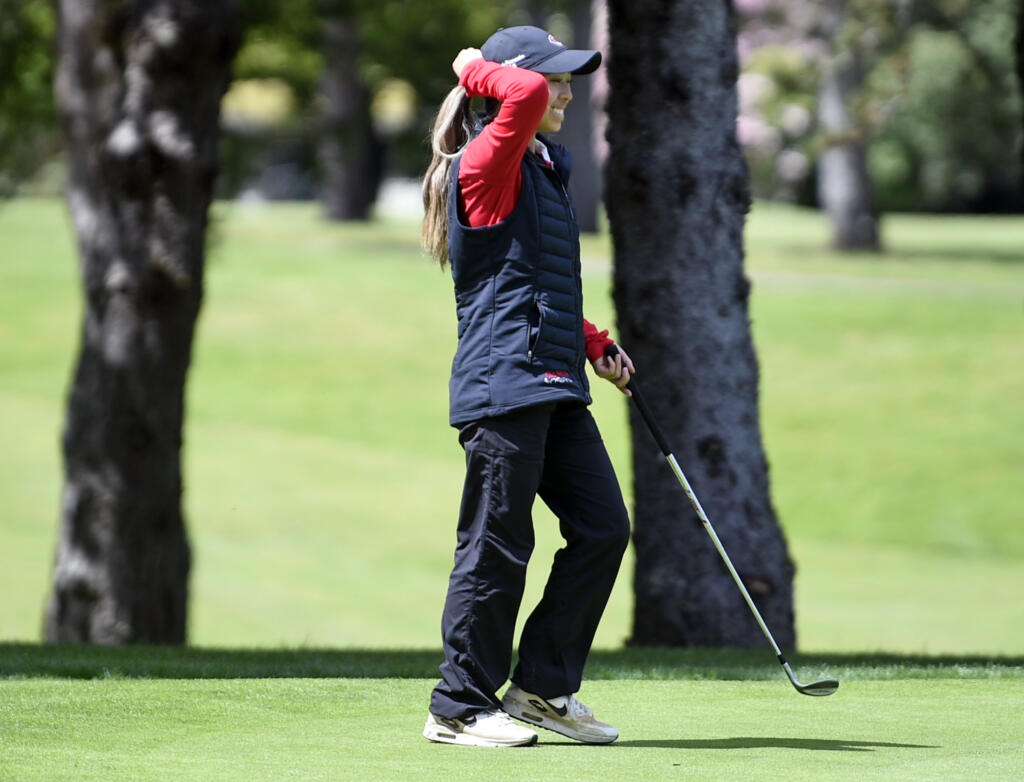 Camas' Jacinda Lee smiles after chipping in a shot for a birdie on the par-3 11th hole during the Class 4A District 4 girls golf tournament on Tuesday, May 7, 2024, at Lewis River Golf Course.
