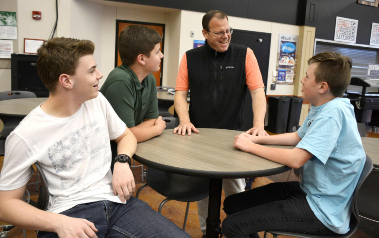Washougal School District Assistant Superintendent Aaron Hansen chats with students Monday.