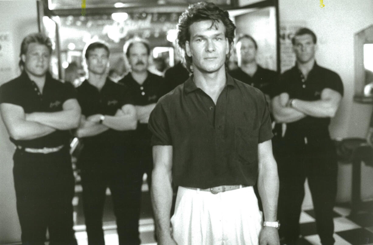 Patrick Swayze is Dalton, the cool-headed barroom bouncer who finds himself fighting against more than he bargained for when he is hired to clean up a rowdy nightclub in United Artists' hard-hitting 1989 action film "Road House." (Peter Sorel/United Artists Pictures)