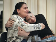 Claudia Saenz, left, and Diana Carolina Guillen hug and cry during a sexual harassment prevention class for nannies and housekeepers on Saturday, April 27, 2024, in the Brooklyn borough of New York. Nannies, housekeepers, and home care workers are excluded from many federal workplace protections in the United States, and the private, home-based nature of the work means abuse tends to happen behind closed doors.