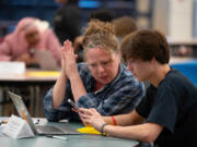 Rachel Hopper and her son Espen Hopper-Willams filled out the FAFSA form together on a laptop during the financial aid workshop at South High School in Minneapolis on Feb. 6.