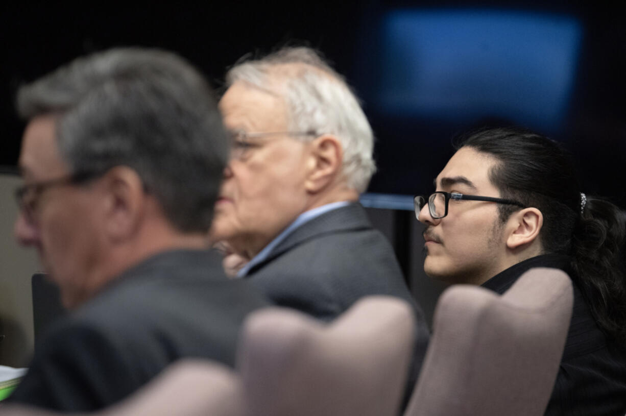 Julio Segura, right, listens to opening statements May 6 for his murder trial in the 2022 death of off-duty Vancouver police Officer Donald Sahota at the Clark County Courthouse.