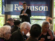 Supporters of Bob Ferguson, at top, enjoy shrimp at the annual shrimp feed fundraiser for Ferguson&rsquo;s gubernatorial campaign Sunday at the Northgate Community Center in Seattle.