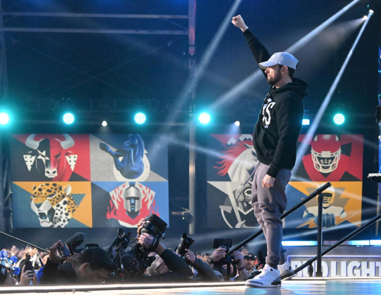 Eminem gestures onstage during the NFL draft in Detroit on April 25, 2024.
