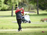 Camas's Jacinda Lee watches her tee shot on the 15th hole during the Class 4A District 4 girls golf tournament on Tuesday at Lewis River Golf Course. Lee won for the third year in a row, this time by 16 strokes.