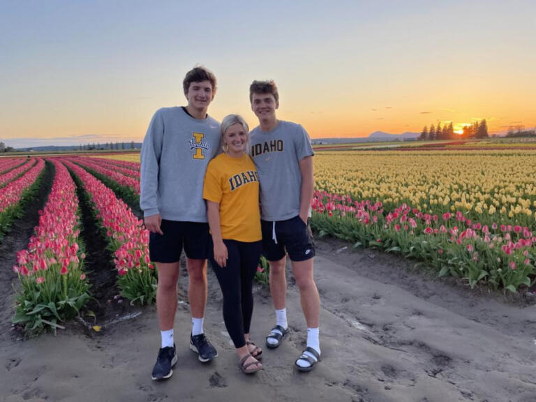 From the left, Ethan and his triplet siblings Maizie and Hunter on a spring day in the Mount Vernon tulip fields, all sporting University of Idaho gear as they await the beginning of their freshman year together.