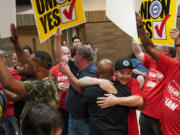 People celebrate after the United Auto Workers (UAW) received enough votes to form a union at a UAW vote watch party on April 19, 2024, in Chattanooga, Tennessee.