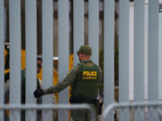 Border Patrol agents work at the U.S. Mexico border at Border Field State Park in San Diego County. (Nelvin C.