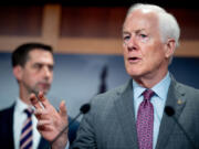 Sen. John Cornyn (R-TX) (right), accompanied by Sen. Tom Cotton (R-AR) (left) speaks during a news conference on Capitol Hill on May 1, 2024, in Washington, D.C.