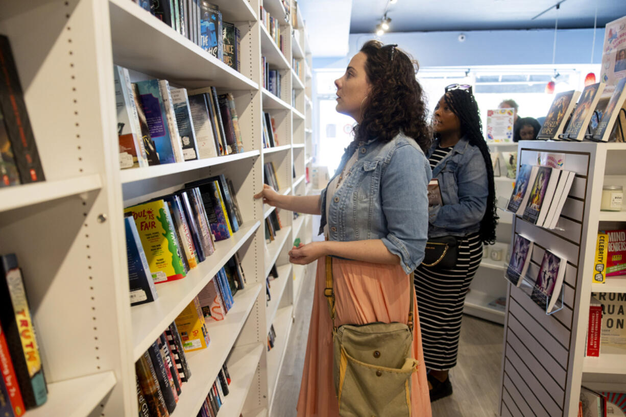 Beverly Halloran, a participant in the Indie Bookstore Day &ldquo;bus extravaganza,&rdquo; shops for books on Indie Bookstore Day on April 27, at Bookie&rsquo;s in Chicago.