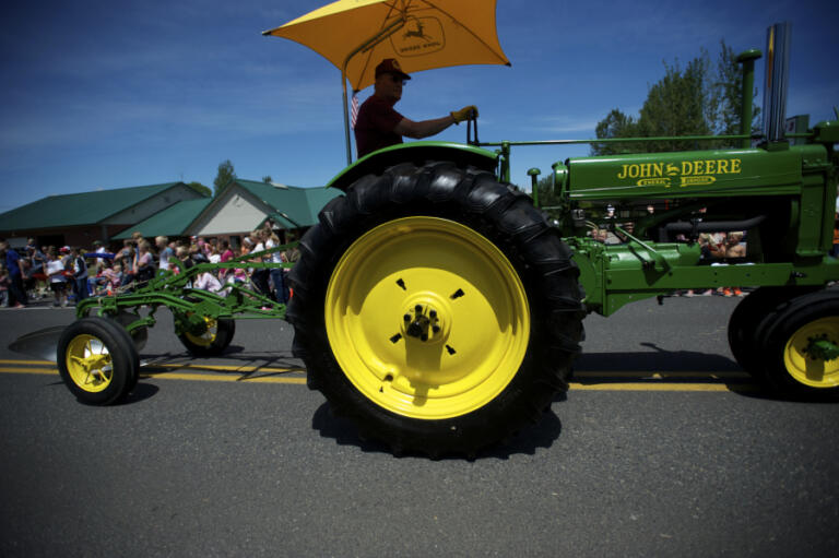 An antique tractor participates in the Hockinson Fun Days Parade.