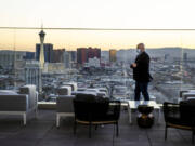 The sun sets on the city viewed from the outside deck within the Legacy Club at Circa on Dec. 22, 2020, in Las Vegas. (L.E.