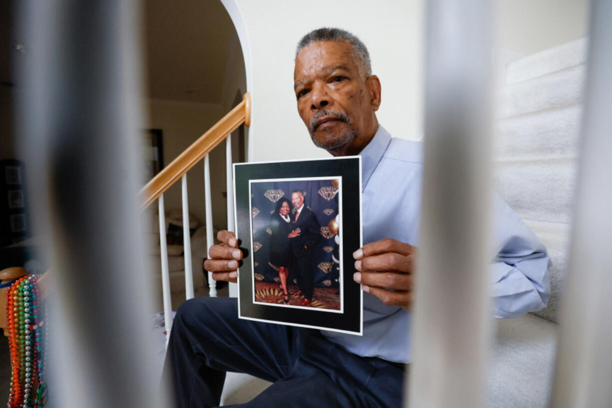 Joseph Larche holds a photograph posing with his late wife Diane Larche on Wednesday, May 15, 2024. Joseph experienced the death of two love one first his wife Diane Larche passed away on January 12 on pancreatic cancer, and two months later his daughter Stephanie died.