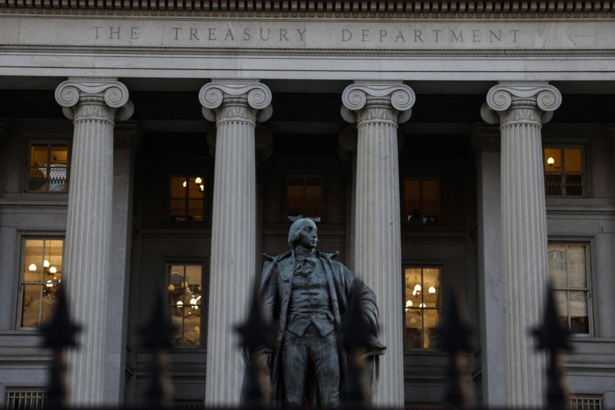 A statue of Alexander Hamilton stands in front of the Treasury Department on Jan. 18, 2023, in Washington, D.C. The Treasury Department announced regulations that will authorize U.S. banks to handle accounts for Cuban private business owners.