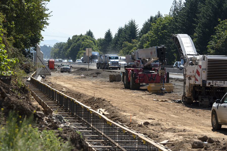 A project to widen state Highway 14 to three lanes in each direction between Interstate 205 and Southeast 164th Avenue is back under construction.
