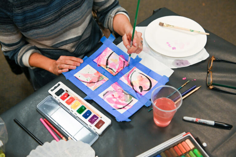 Amy Rosenthal tries to paint badly at the Camas Public Library&rsquo;s Feb. 17 Bad Art Night.