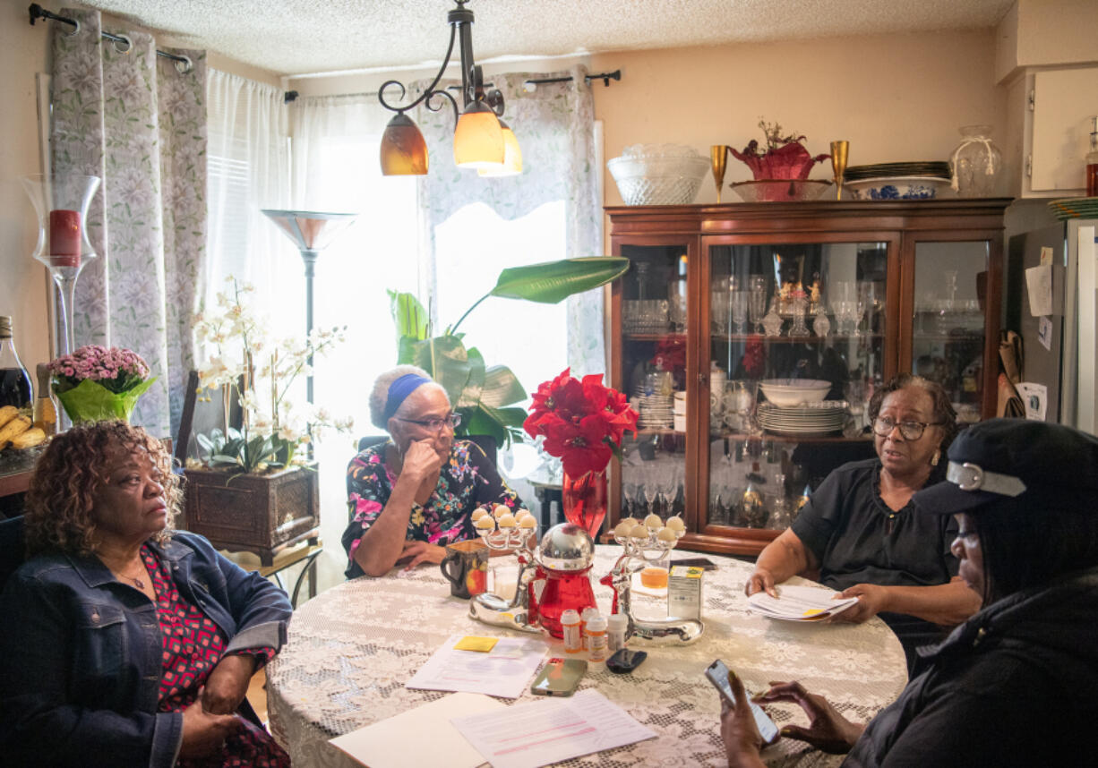 Rev. Joyce Smith, clockwise from left, Cindi Fisher, Bettie Le&rsquo;Sueur and Balinda Olive-Beltran talk about the disappearance of LeSueur&rsquo;s son Jacques at Bettie Le&rsquo;Sueur&rsquo;s house in east Vancouver. Bettie has not heard from him since he was transported to Western State, a psychiatric hospital, more than a year ago.