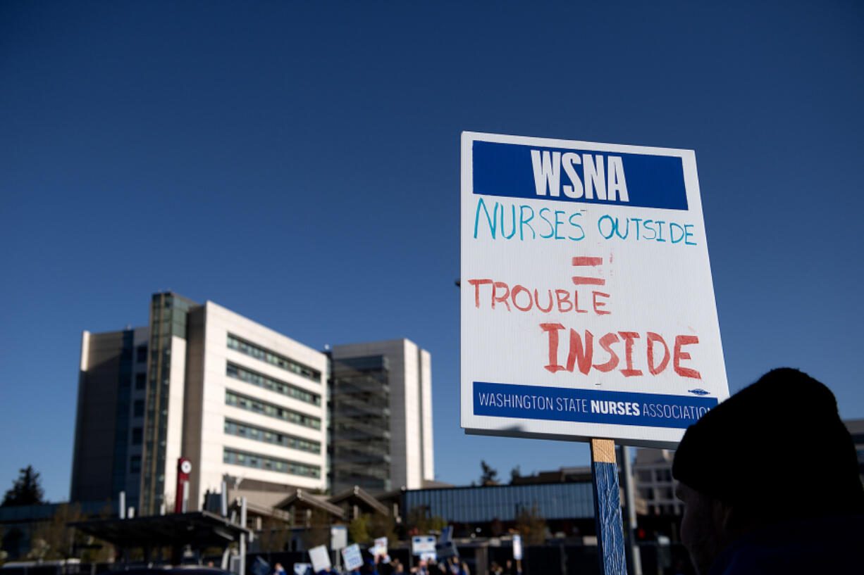 Picketers greet morning drivers outside PeaceHealth Southwest Medical Center on April 18.