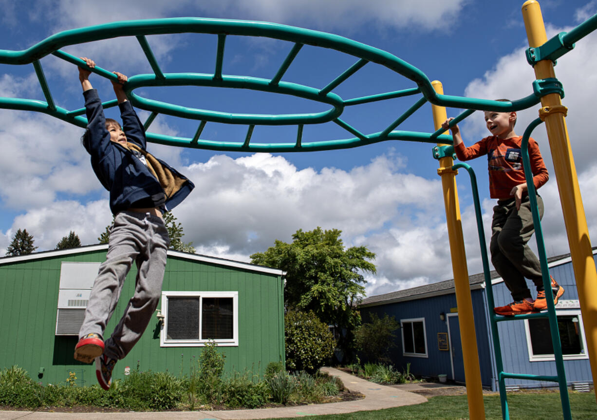 First-graders Arashi Buell, left, and Temour Pashigorev enjoy playtime at Gardner School of Arts &amp; Sciences in Mount Vista during recess on Monday afternoon. Gardner is a local nonprofit school based in experiential learning. School leaders announced Wednesday they are acquiring Country Friends Child Care Center in Hockinson, which will double their total enrollment.
