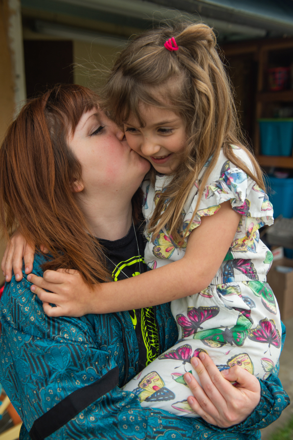 Karissa Halstrom embraces her 6-year-old daughter, Frankie. Becoming a mother fueled Halstrom&rsquo;s activism.