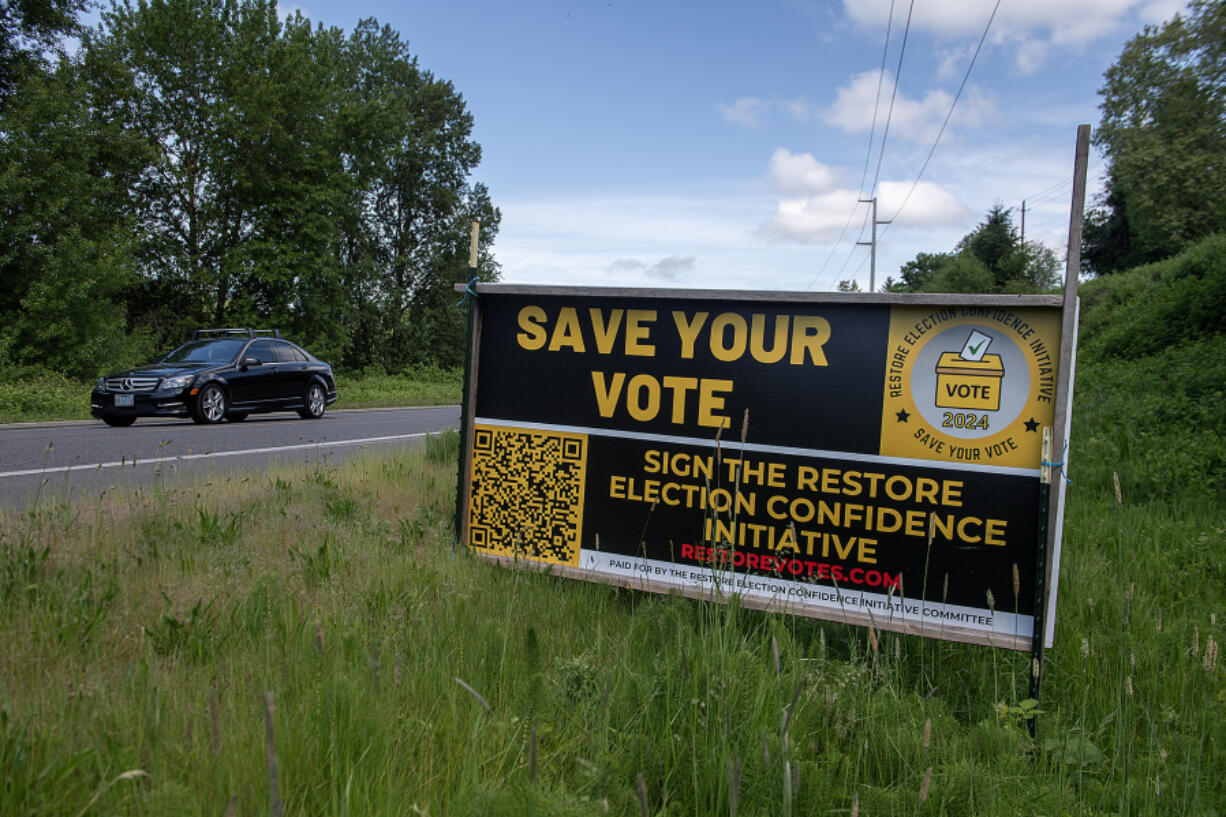 Reform Clark County signature gatherers hoped to get the Restore Election Confidence initiative on November's ballot.