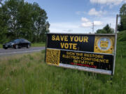 Reform Clark County signature gatherers hoped to get the Restore Election Confidence initiative on November's ballot.