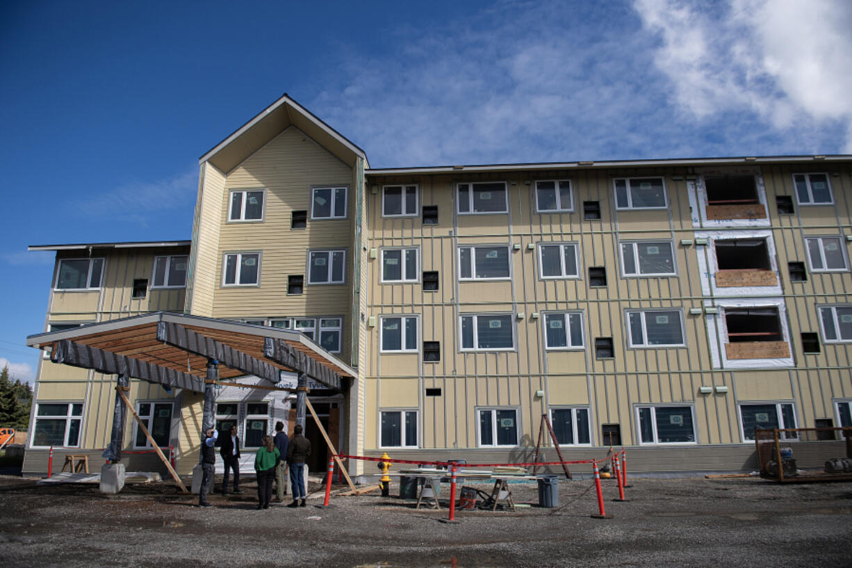 Construction continues Thursday morning at Laurel Manor, a low-income senior apartment building in Vancouver. The four-story, 82-unit building is midway through construction, and officials hope to be ready to open the doors around the end of the year.