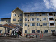 Construction continues Thursday morning at Laurel Manor, a low-income senior apartment building in Vancouver. The four-story, 82-unit building is midway through construction, and officials hope to be ready to open the doors around the end of the year.