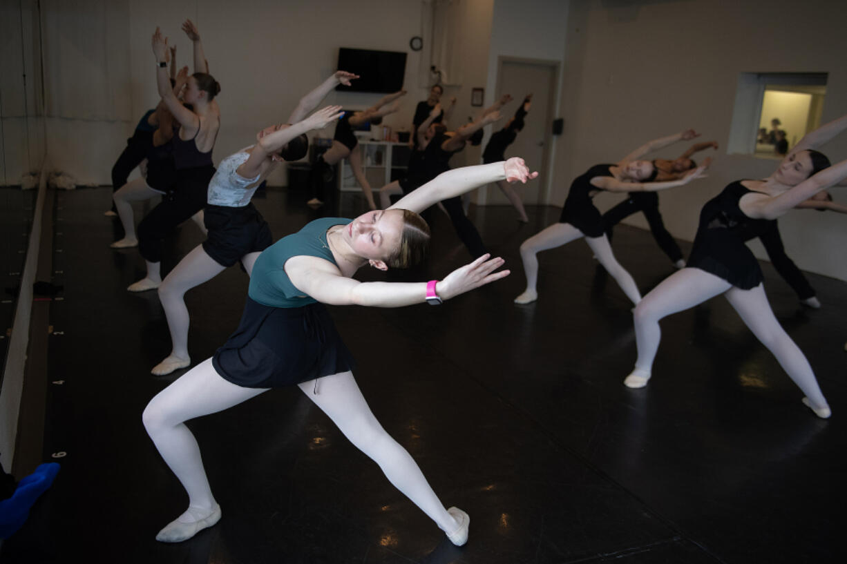 Hayden Ring, 17, of Vancouver, left, joins fellow students at DanceWorks Performing Arts. In its 30 years in business, tens of thousands of Clark County kids have pranced through the doors of the East Vancouver dance studio.