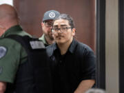 Julio Segura, 22, makes his way into the courtroom last week for his murder trial in the January 2022 death of off-duty Vancouver police Officer Donald Sahota at the Clark County Courthouse. The jury saw photos Monday of Sahota&rsquo;s injuries while first responders attempted to provide him medical aid.