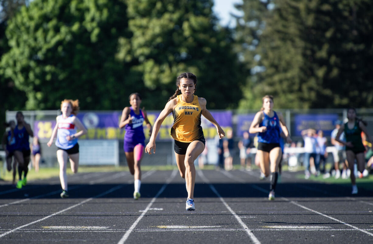 Hudson’s Bay sophomore Paris Ackerman, center, wins the 400 meter dash Thursday, May 9, 2024, during the 2A GSHL Track and Field Championships at Columbia River High School.