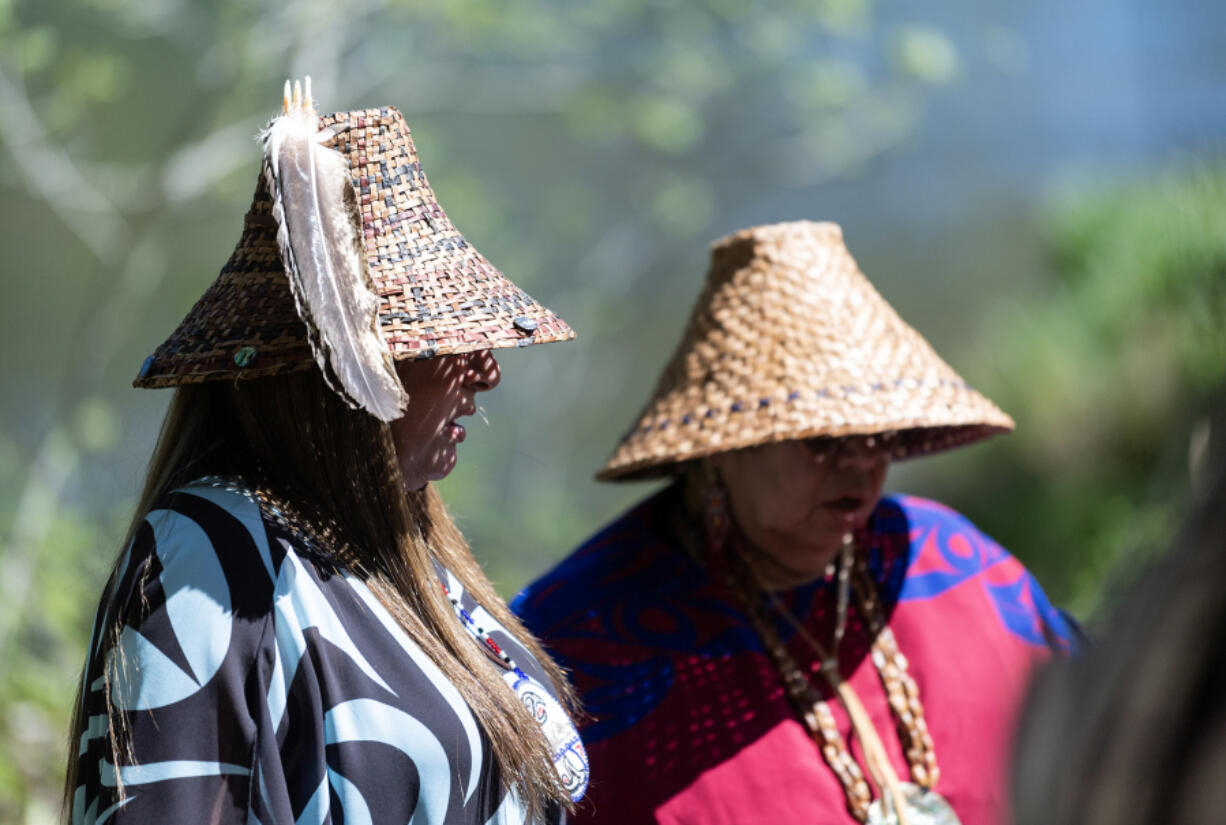 Cowlitz Indian Tribe Chair Patty Kinswa-Gaiser, right, and council member Suzanne Donaldson perform a &ldquo;calling in the ancestors&rdquo; song Friday at Kwoneesum Dam northeast of Washougal. The decades-old dam is being removed to restore Wildboy Creek.