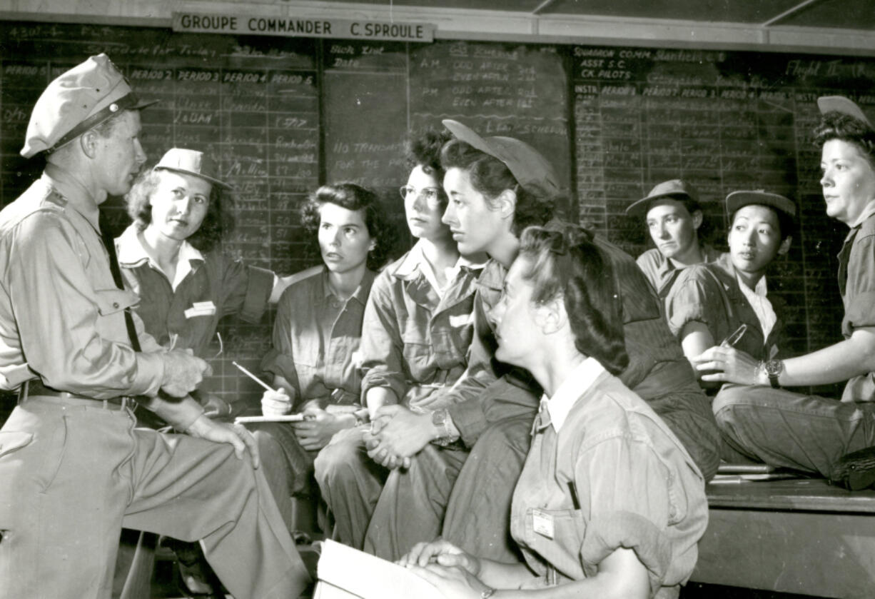 Hazel Ying Lee is second from right in this 1943 photo of a briefing for ferrying-pilot trainees at Avenger Field.