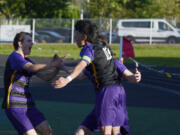 Columbia River&rsquo;s J.P. Guzman (10) celebrates his first goal against Renton in the Class 2A boys soccer state playoffs with teammates Evan Roscoe, left, and Ryland Perron, back, on Tuesday, May 14, 2024 at Columbia River High School.