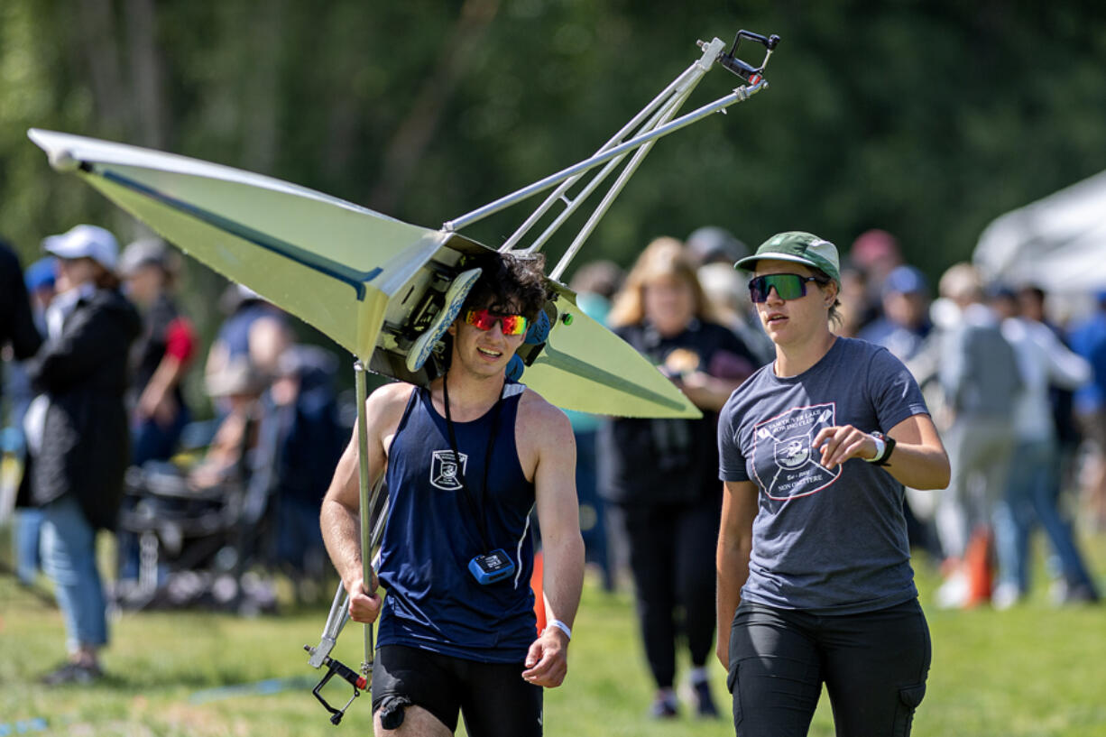 Callum Brown of the Vancouver Lake Rowing Club, left, talks with Jamie Phelps while taking part in the USRowing Northwest Youth Championships at Vancouver Lake on Friday morning.