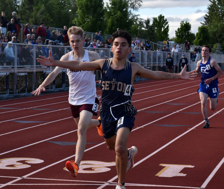 Cohen Thomas (4) of Seton Catholic beats Benny Anderson (3) of Montesano in the boys 1,600 meters at the 1A District 4 track and field championships at Seton Catholic High School in Vancouver on Thursday, May 16, 2024.