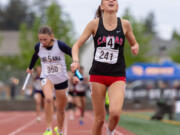 Camas’ Eliisa Marshall grimaces as she crosses the finish line in second place of the 4A Girls 4x400 relay on Saturday, May 25, at the 2A/3A/4A State Track at Mount Tahoma High School in Tacoma.