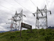 A sign for the Bonneville Lock &amp; Dam is seen from the Washington side of the Columbia River on Tuesday morning.