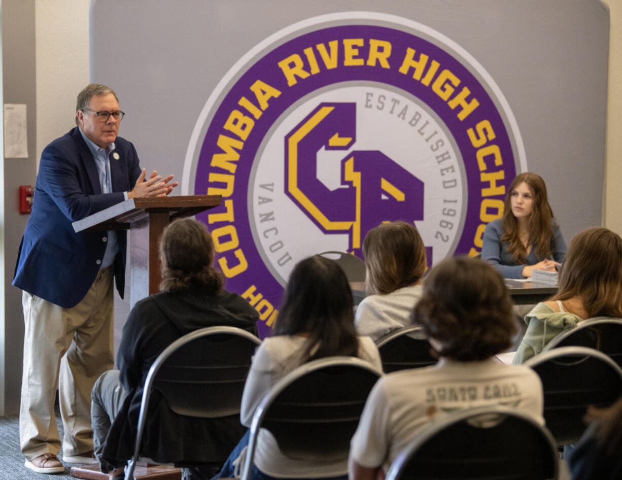 Washington Lt. Gov. Denny Heck, left, talks to a room of Columbia River High School students Tuesday at the school. Heck graduated from Columbia River in 1970.