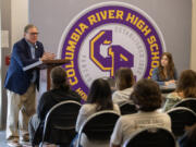 Washington Lt. Gov. Denny Heck, left, talks to a room of Columbia River High School students Tuesday at the school. Heck graduated from Columbia River in 1970.