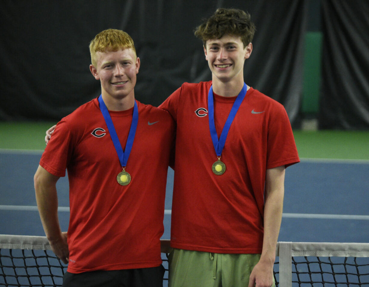 Tommy James (left) and Aiden Brasier of Camas pose for a photo after winning the boys doubles state title at the 4A state tennis tournament at The Pacific Clinic in Kennewick on Saturday, May 25, 2024.